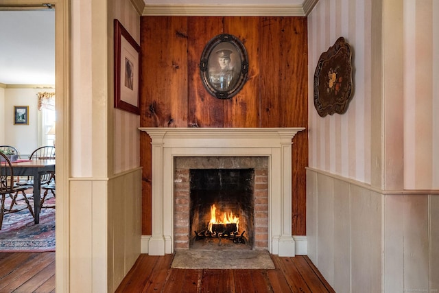 120 Boston Post Rd, Old Lyme, CT 06371 - detailed view of wainscoting, a fireplace, wallpapered walls, wood finished floors, and crown molding
