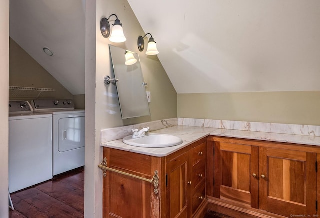 120 Boston Post Rd, Old Lyme, CT 06371 - bathroom featuring washer and dryer, lofted ceiling, hardwood / wood-style floors, and vanity