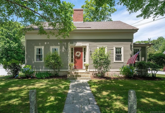 120 Boston Post Rd, Old Lyme, CT 06371 - view of front of house featuring a front yard, a chimney, and a shingled roof