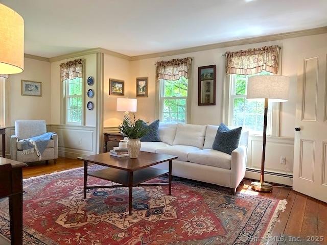120 Boston Post Rd, Old Lyme, CT 06371 - living area with baseboard heating, ornamental molding, hardwood / wood-style floors, and plenty of natural light
