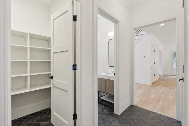 interior space featuring baseboards and ornamental molding