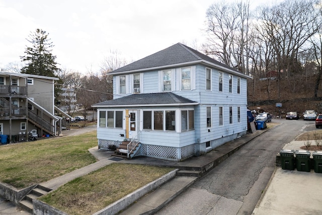 44 Hunters Ave, Norwich, CT 06380 - view of front of property featuring a shingled roof, entry steps, and a front lawn