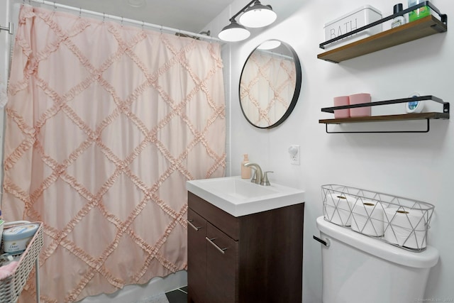 bathroom featuring toilet, vanity, and shower / bath combo with shower curtain