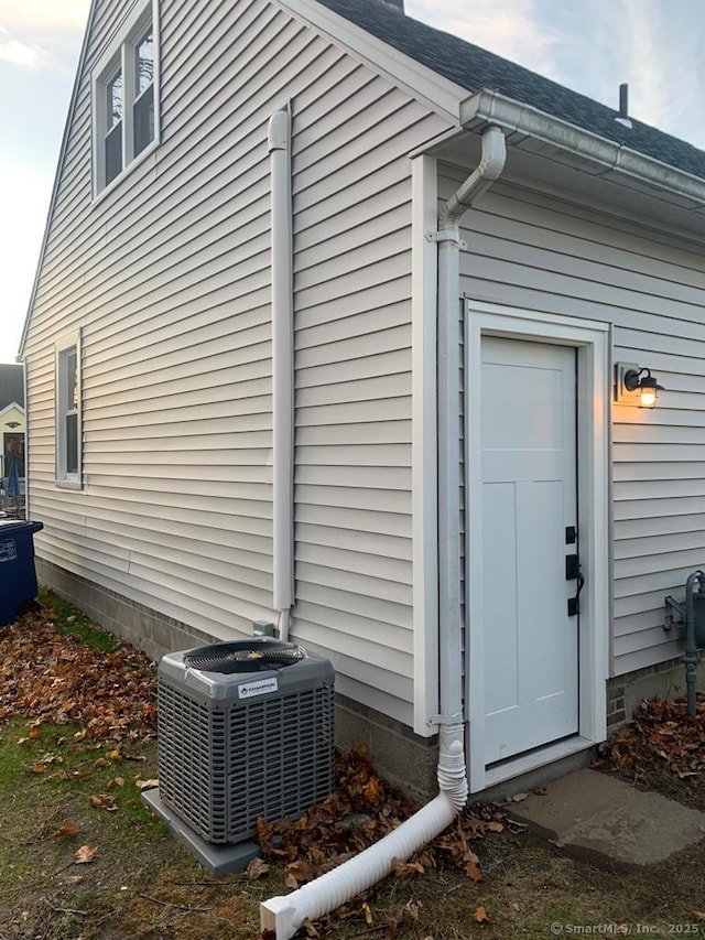 view of home's exterior with central air condition unit