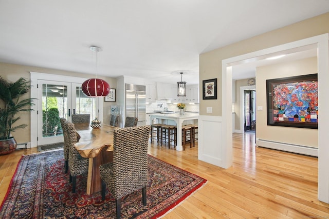 34 Kent Rd, Warren, CT 06754 - dining area featuring a baseboard heating unit, light wood-style floors, and french doors