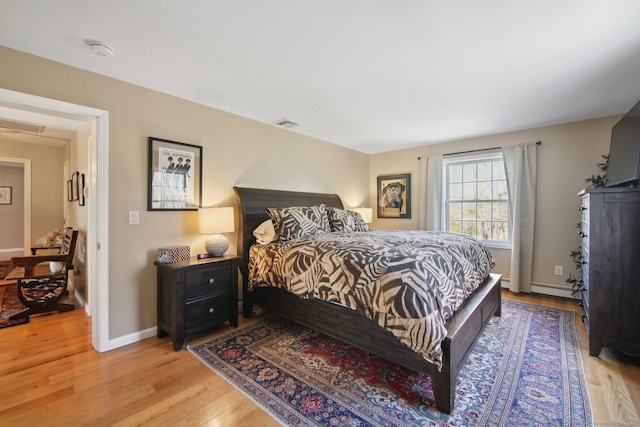 34 Kent Rd, Warren, CT 06754 - bedroom with light wood-type flooring, baseboards, and baseboard heating