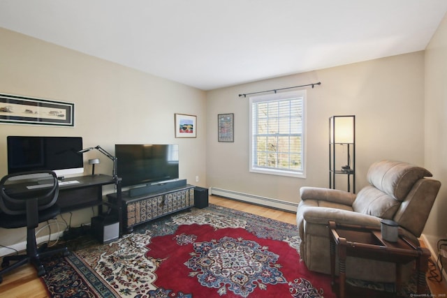34 Kent Rd, Warren, CT 06754 - living area featuring a baseboard heating unit, wood finished floors, and a desk