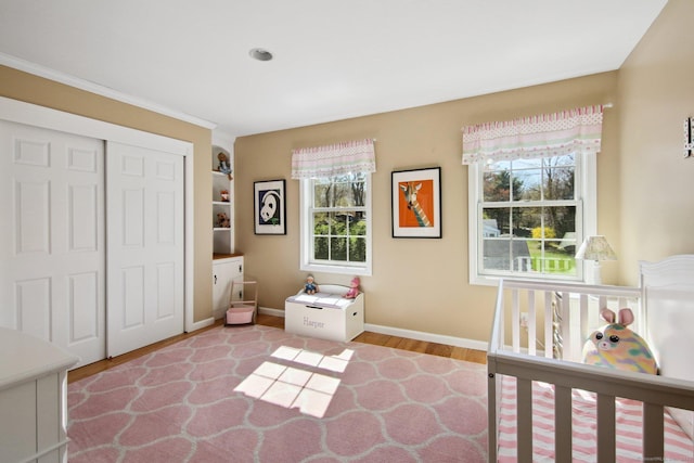 34 Kent Rd, Warren, CT 06754 - bedroom featuring wood finished floors, baseboards, a closet, and ornamental molding
