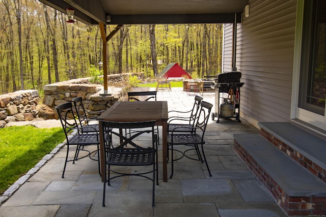 34 Kent Rd, Warren, CT 06754 - view of patio / terrace with outdoor dining space, area for grilling, and a forest view