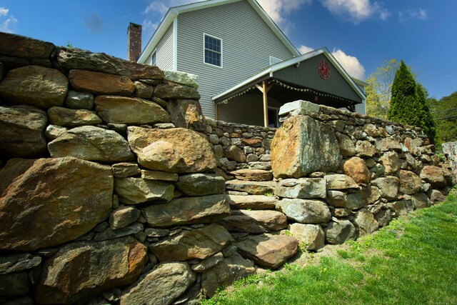34 Kent Rd, Warren, CT 06754 - view of property exterior with a chimney