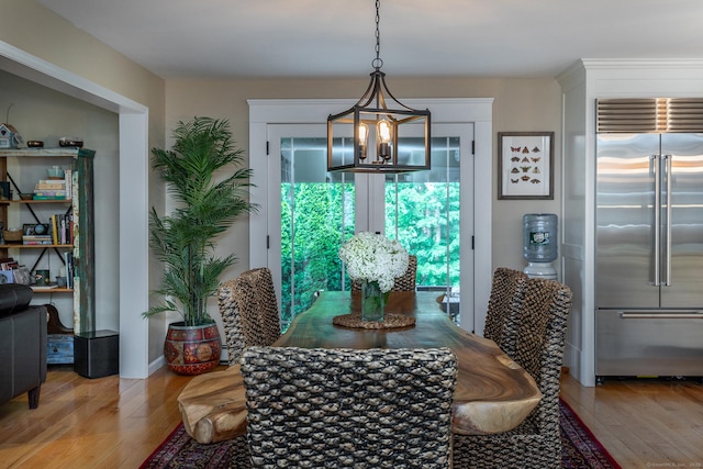 34 Kent Rd, Warren, CT 06754 - dining area with a chandelier and hardwood / wood-style floors