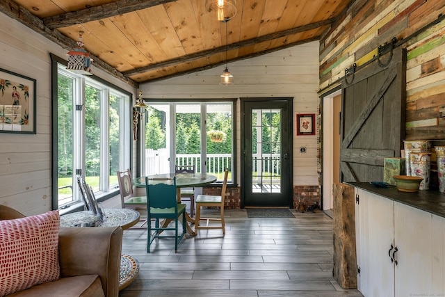34 Kent Rd, Warren, CT 06754 - dining area featuring wood walls, plenty of natural light, wooden ceiling, hardwood / wood-style floors, and a barn door