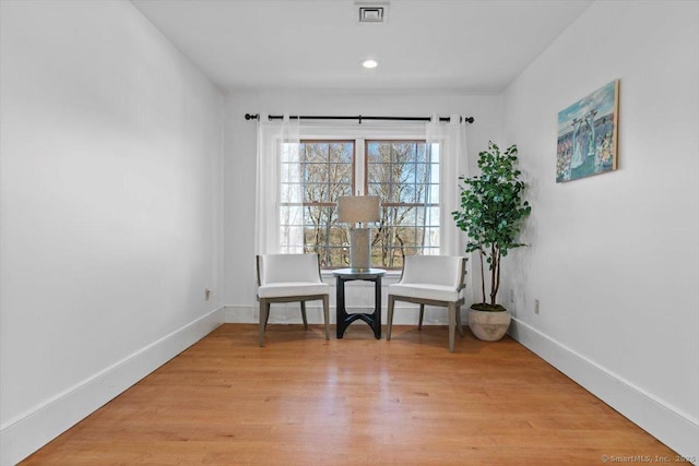 unfurnished room with visible vents, baseboards, recessed lighting, and light wood-style floors