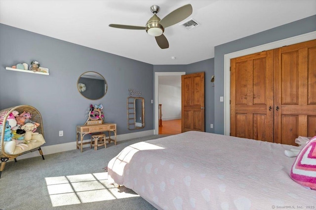 carpeted bedroom featuring visible vents, baseboards, and ceiling fan