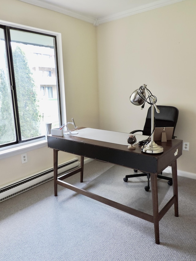 carpeted office space featuring a healthy amount of sunlight, a baseboard heating unit, baseboards, and ornamental molding
