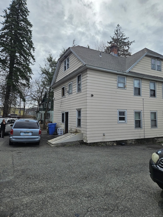 view of side of property with a chimney
