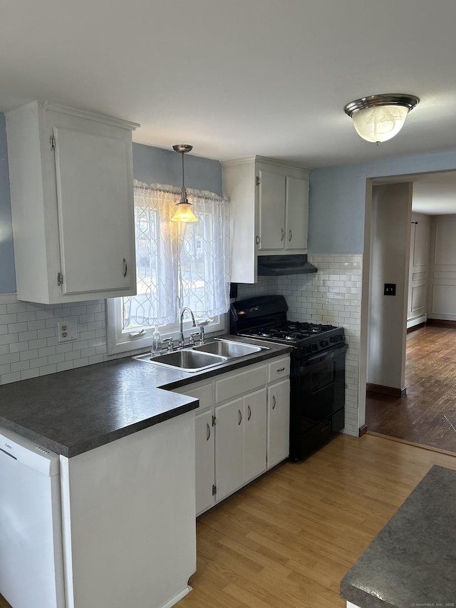 18 Nancy Dr, Enfield, CT 06082 - kitchen featuring black range with gas cooktop, dark countertops, under cabinet range hood, white dishwasher, and a sink