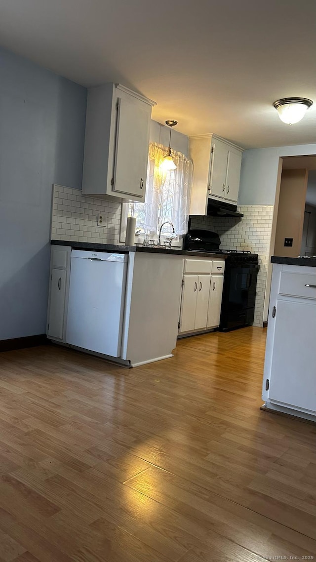 18 Nancy Dr, Enfield, CT 06082 - kitchen featuring wood finished floors, white dishwasher, backsplash, and dark countertops