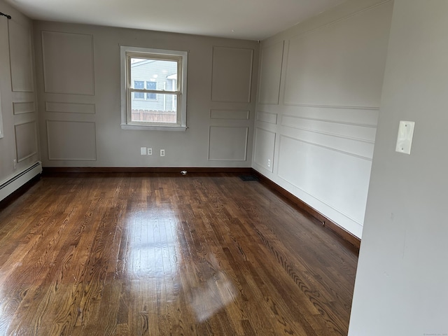 18 Nancy Dr, Enfield, CT 06082 - spare room featuring dark wood-type flooring and baseboards