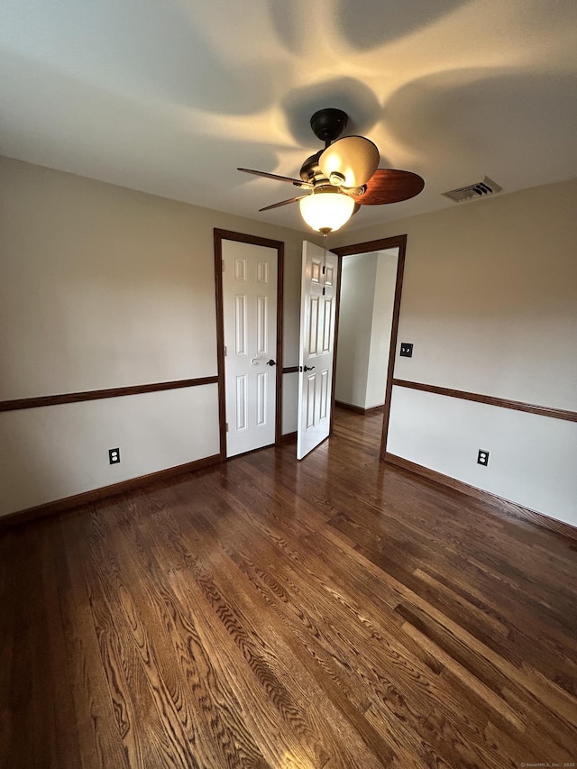 18 Nancy Dr, Enfield, CT 06082 - unfurnished room featuring dark wood-type flooring, baseboards, a ceiling fan, and visible vents