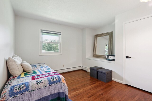 36 Musket Ridge Rd, New Fairfield, CT 06812 - bedroom featuring a baseboard heating unit and wood finished floors