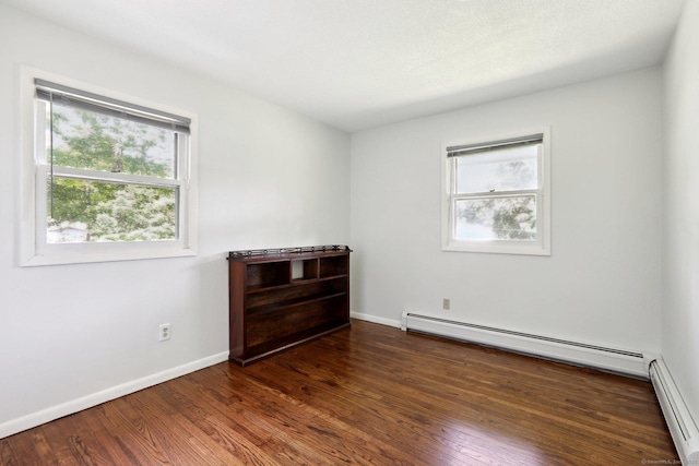 36 Musket Ridge Rd, New Fairfield, CT 06812 - empty room with a baseboard heating unit, baseboard heating, and wood finished floors