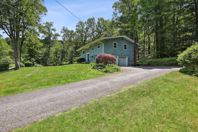 36 Musket Ridge Rd, New Fairfield, CT 06812 - view of side of property with a garage, driveway, and a yard