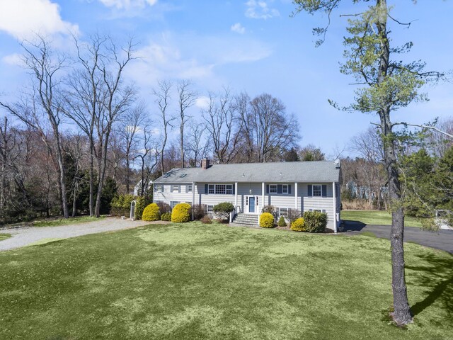 285 Greens Farms Rd, Westport, CT 06880 - split foyer home with a front yard, a chimney, driveway, and view of scattered trees