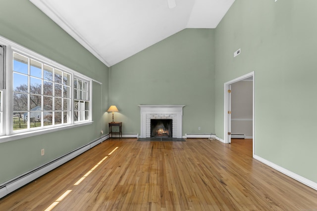 285 Greens Farms Rd, Westport, CT 06880 - unfurnished living room with a baseboard radiator, high vaulted ceiling, wood finished floors, a brick fireplace, and a baseboard heating unit