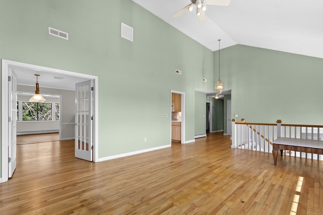 285 Greens Farms Rd, Westport, CT 06880 - unfurnished living room with ceiling fan, light wood-type flooring, high vaulted ceiling, baseboard heating, and baseboards