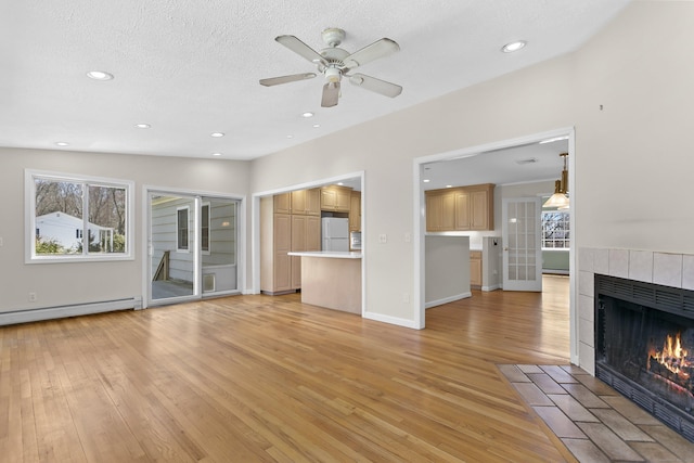 285 Greens Farms Rd, Westport, CT 06880 - unfurnished living room featuring a fireplace, light wood finished floors, a ceiling fan, recessed lighting, and baseboards