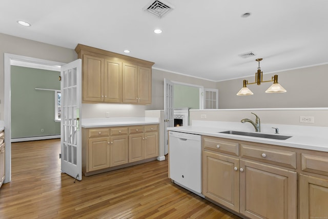 285 Greens Farms Rd, Westport, CT 06880 - kitchen featuring white dishwasher, a sink, light countertops, light wood-style flooring, and a baseboard radiator