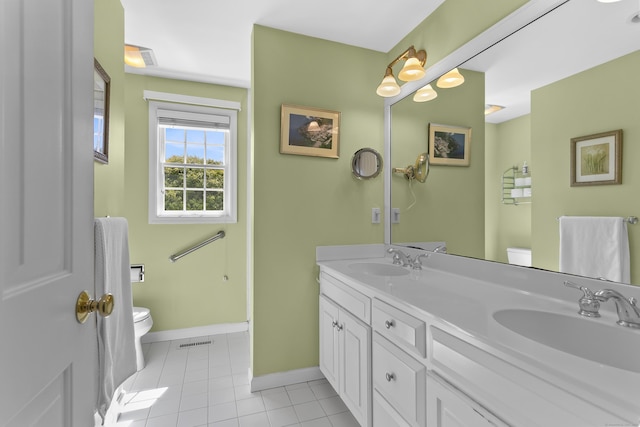 285 Greens Farms Rd, Westport, CT 06880 - bathroom with toilet, tile patterned floors, baseboards, and double vanity