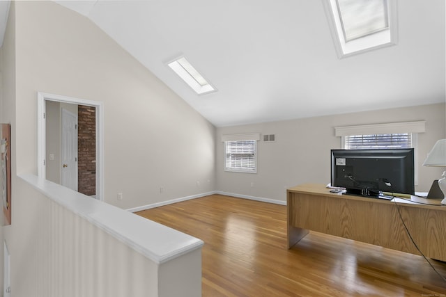 285 Greens Farms Rd, Westport, CT 06880 - unfurnished office featuring a skylight, wood finished floors, baseboards, and high vaulted ceiling