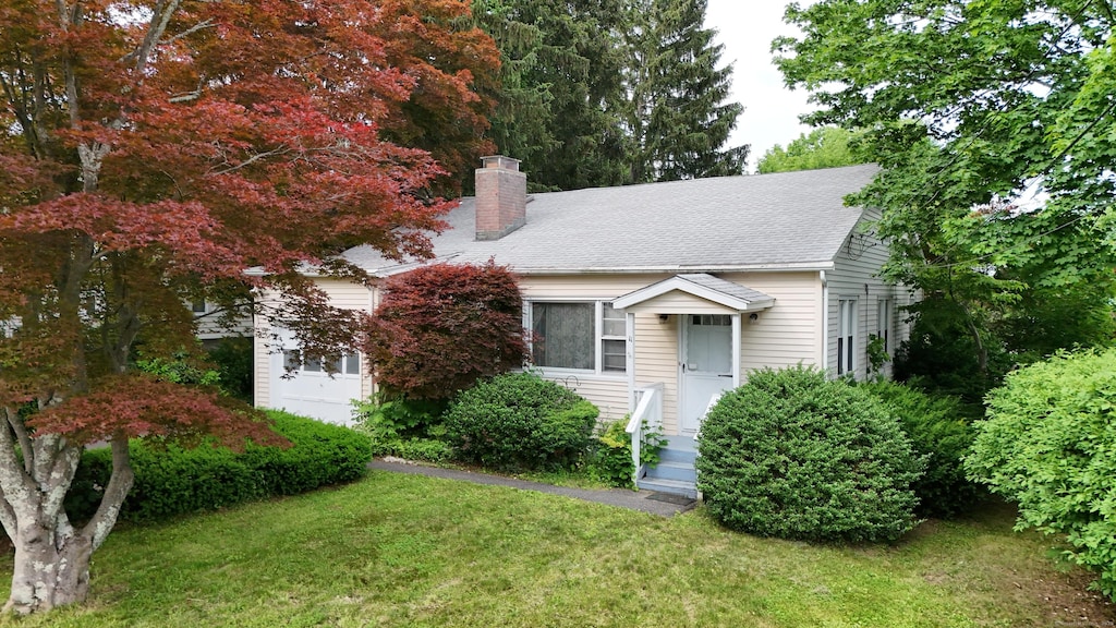 11 Well Ave, Danbury, CT 06810 - view of front of house with a chimney and a front lawn