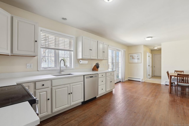 kitchen featuring stainless steel dishwasher, white cabinets, a sink, a baseboard radiator, and dark wood-type flooring