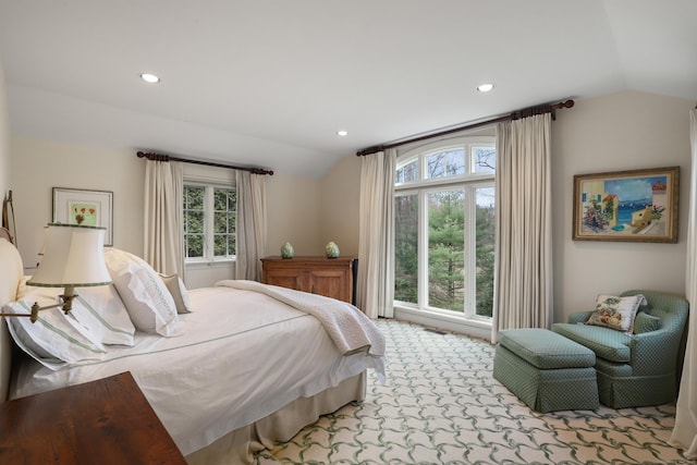 carpeted bedroom featuring vaulted ceiling and recessed lighting