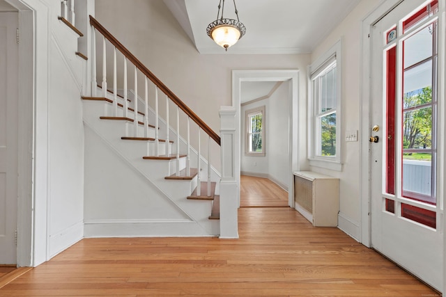 entryway with stairs and light wood-style floors