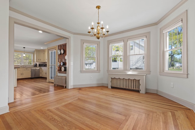 unfurnished dining area with baseboards, radiator heating unit, ornamental molding, and a notable chandelier