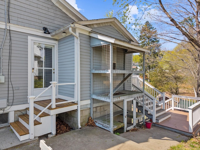 view of home's exterior with a wooden deck