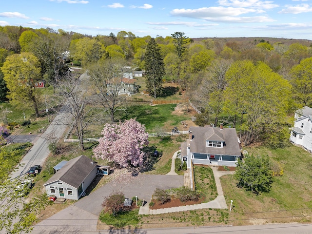 drone / aerial view featuring a view of trees