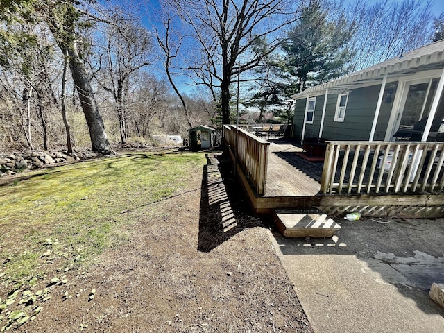 view of yard featuring a wooden deck