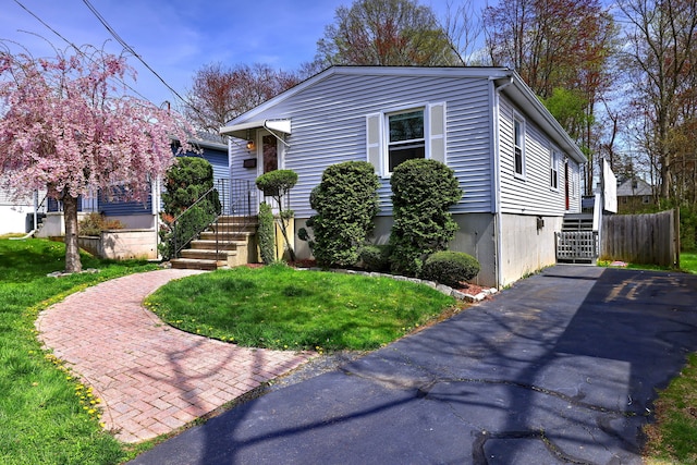 137 Harding Ave, West Haven, CT 06516 - view of front of property featuring a front lawn, stairs, and driveway