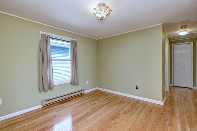 137 Harding Ave, West Haven, CT 06516 - spare room featuring a baseboard radiator, light wood-type flooring, baseboards, crown molding, and a smoke detector