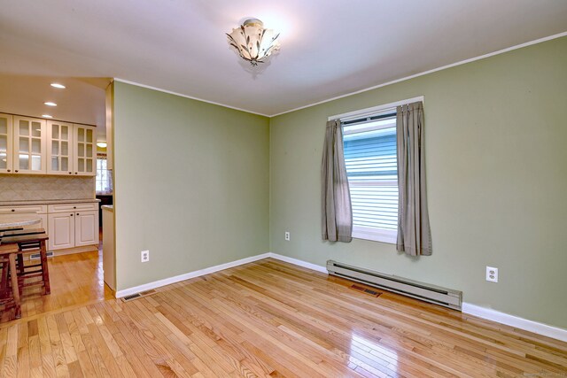 137 Harding Ave, West Haven, CT 06516 - spare room with a baseboard heating unit, light wood-style flooring, crown molding, baseboards, and recessed lighting