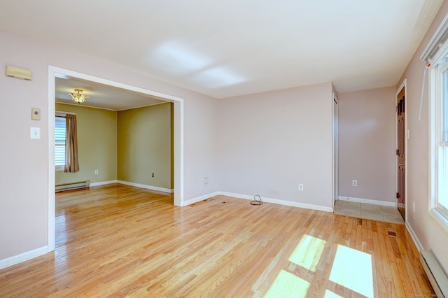 137 Harding Ave, West Haven, CT 06516 - spare room featuring a baseboard radiator, light wood finished floors, baseboard heating, and baseboards