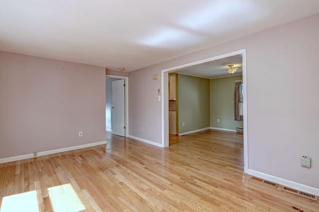 137 Harding Ave, West Haven, CT 06516 - unfurnished room with light wood-type flooring, baseboards, and a baseboard radiator
