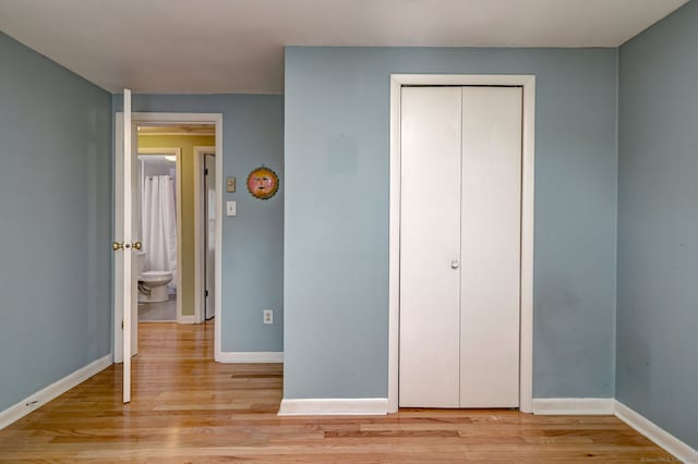 137 Harding Ave, West Haven, CT 06516 - unfurnished bedroom with light wood-type flooring, baseboards, and a closet