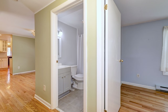 137 Harding Ave, West Haven, CT 06516 - full bath featuring wood finished floors, vanity, toilet, baseboards, and baseboard heating