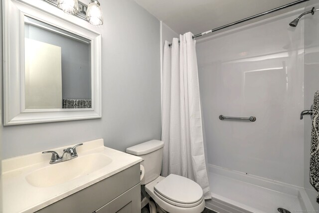 137 Harding Ave, West Haven, CT 06516 - bathroom with a shower stall, toilet, and vanity